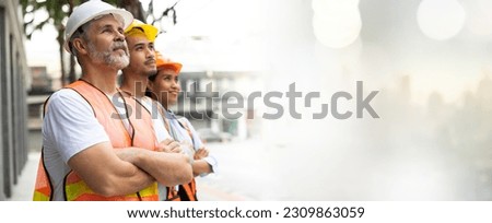 Panoraman banner. Unity and teamwork concept. Architect contractor senior man and team engineering standing together in construction site. Professional construction civil engineer team Royalty-Free Stock Photo #2309863059
