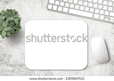 minimalist mousepad mockup with pad, mouse, keyboard and a potted succulent on a white wooden office desk, modern minimal workspace template for your product or design, top view, flat lay Royalty-Free Stock Photo #2309869531