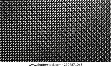 Gray grained carbon fiber background closeup macro