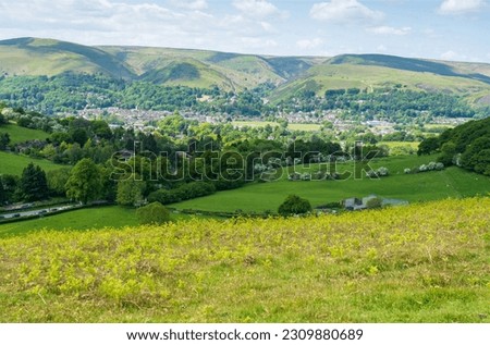 A view towards the Market Town of Church Stretton from Hope Bowdler Hill in the Shropshire Hills Area of Natural Beauty AONB, UK with the Long Mynd Hill Range behind