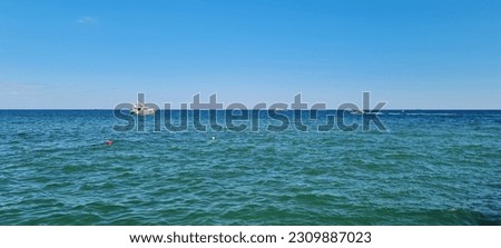 Peaceful nautical scene on a sunny summer day. Natural beauty of the surf.