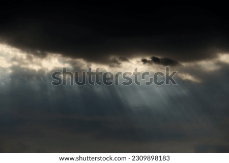 Early spring cloudy sky with natural sunbeams