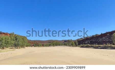 Red outback centre of Australia in Finke Gorge National Park Royalty-Free Stock Photo #2309909899