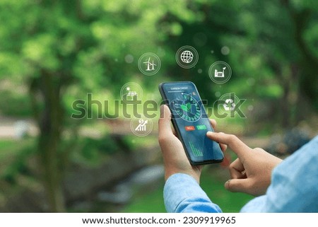 carbon credit concept. Trader using a smartphone to trade carbon credit on application. carbon etf to invest in sustainable business. green climate funds investment. Net zero emission.Clean technology Royalty-Free Stock Photo #2309919965
