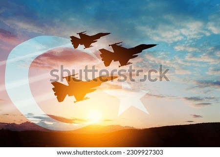 Aircraft silhouettes on background of sunset with a transparent Turkey flag. Turkish Air Force aerobatic demonstration. Air Force Day. Turkish Air Force Foundation Day. Royalty-Free Stock Photo #2309927303
