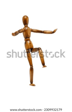 Wooden brown mannequin in motion