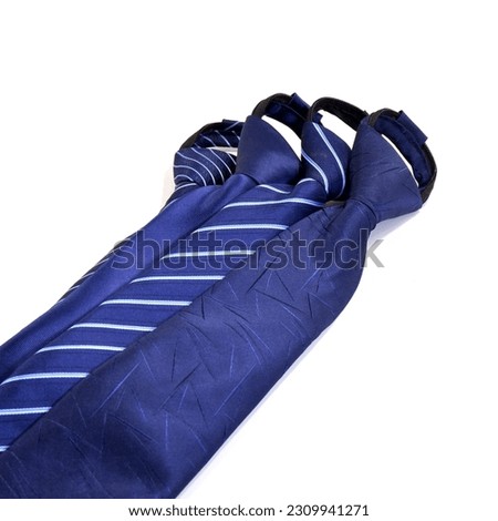 variety of zipper neckties layered together side by side, bunch of men's fashionable neck ties isolated on white background close up view 