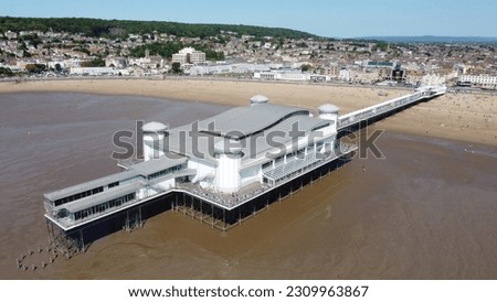 Aerial photography of the Grand Pier at Weston-super-Mare beach in summer and at low tide. Royalty-Free Stock Photo #2309963867