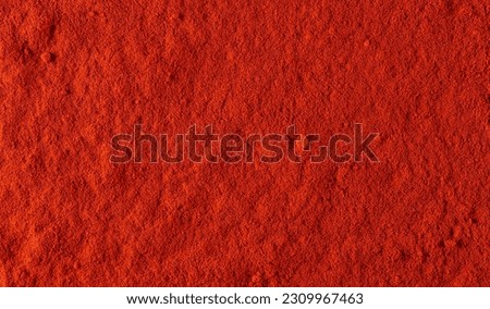 Red paprika powder background and texture Royalty-Free Stock Photo #2309967463