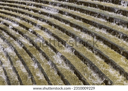 decorative picture of Water flowing down a flight of stairs