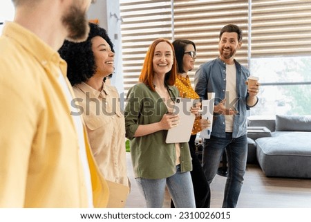 Happy multi ethnic team, diverse colleagues smiling, walking to the meeting room in modern office interior. People. Coworkers. Business partners, Human resources, Lifestyle. Career and personal growth Royalty-Free Stock Photo #2310026015