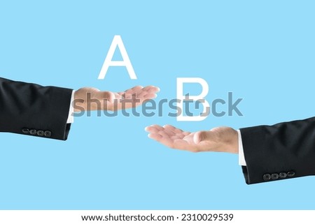 Business man's hands with alphabet A and B