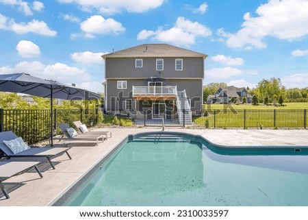 Luxury private backyard with a inground pool Royalty-Free Stock Photo #2310033597