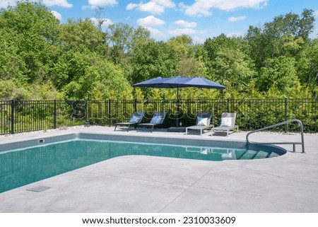 Luxury private backyard with a inground pool Royalty-Free Stock Photo #2310033609