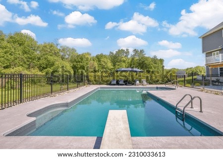 Luxury private backyard with a inground pool Royalty-Free Stock Photo #2310033613