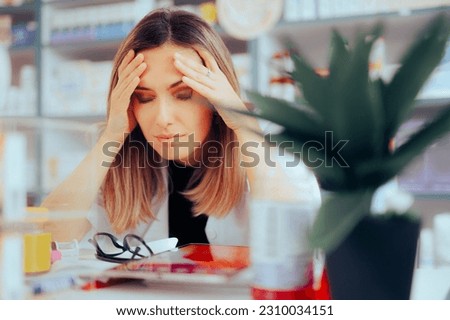 

Worried Pharmacist Suffering from Headaches and Stress
Unhappy stressed medical worker feeling overwhelmed 
 Royalty-Free Stock Photo #2310034151