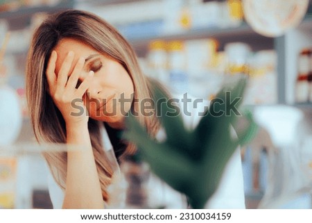 

Worried Pharmacist Suffering from Headaches and Stress
Unhappy stressed medical worker feeling overwhelmed 
 Royalty-Free Stock Photo #2310034159