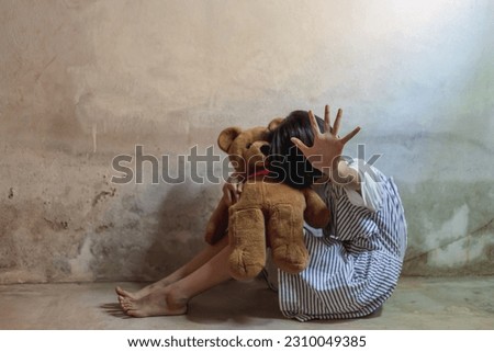 Kid girl showing hand signaling to stop useful to campaign against violence and pain. Human trafficking concept, human rights violations, Stop violence and abused children and woman. Royalty-Free Stock Photo #2310049385
