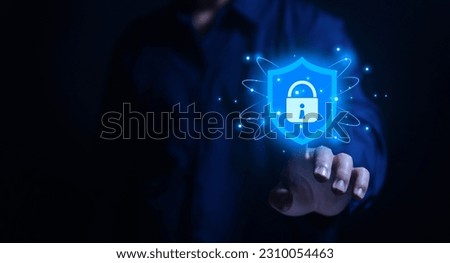 Businessman hand showing shield icon with lock sign Computer password protection concept, internet network security, digital cyber technology, business data, and virus protection.