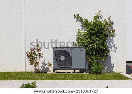 heat pump in a new building area with modern house facades of south germany on a sunny day in springtime Royalty-Free Stock Photo #2310061727