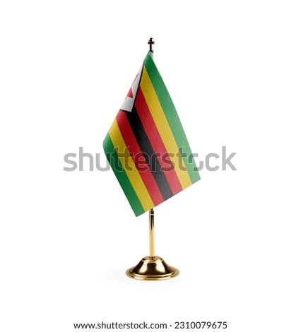Small national flag of the Zimbabwe on a white background. Royalty-Free Stock Photo #2310079675