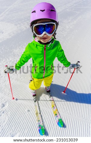 Skiing, winter vacation - young skier on mountainside