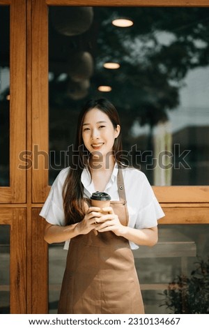 Startup successful small business owner sme woman stand with tablet  in cafe restaurant. woman barista cafe owner. 
