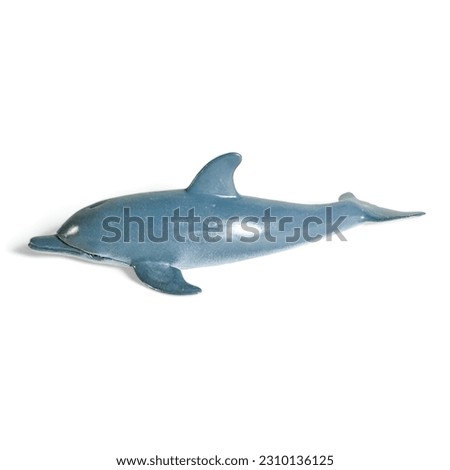 Miniature dolphin animal toy on a white background