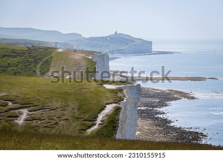 View of the brows and bottoms of the Seven sisters looking back to Birling Gap from Cuckmere Haven on the east Sussex coast south east England Royalty-Free Stock Photo #2310155915