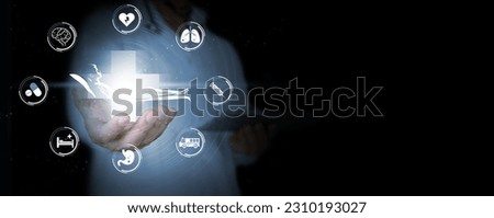Patient-Centered or Person-Centered Approach: Hands of a Doctor Supporting a Patient on a Bed Surrounded with Medical and Healthcare Icons. Collaborative Care with Healthcare Professionals. Royalty-Free Stock Photo #2310193027