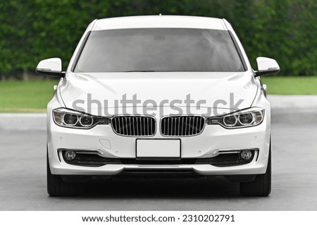 
white car front view See clearly, double headlights, hood Royalty-Free Stock Photo #2310202791