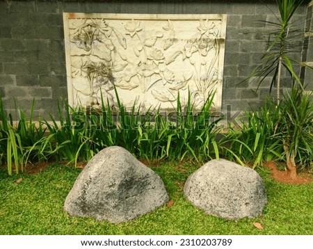 two large stones in the garden
