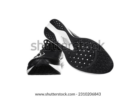Pair of new unbranded black sport running shoes or sneakers isolated on white background with clipping path. High quality photo