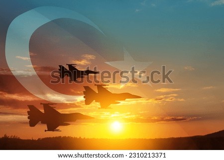 Aircraft silhouettes on background of sunset with a transparent Turkey flag. Turkish Air Force aerobatic demonstration. Air Force Day. Turkish Air Force Foundation Day. Royalty-Free Stock Photo #2310213371