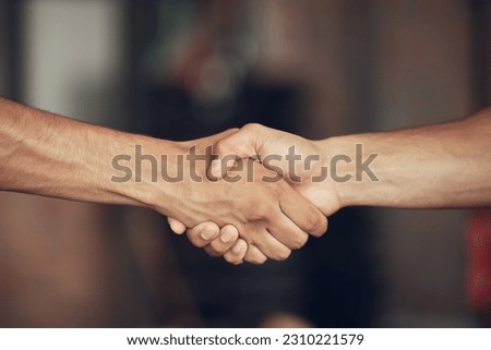 Fitness, handshake and people at a gym for training, agreement and deal on blurred background. Sport, friends and men shaking hands for healthy lifestyle commitment, goal and personal trainer support Royalty-Free Stock Photo #2310221579