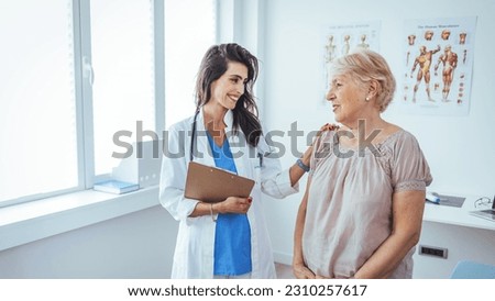 Shot of a senior woman having a consultation with her doctor. Senior woman having a doctors appointment. Doctor in blue uniform and protective face mask giving advice to Senior female patient Royalty-Free Stock Photo #2310257617