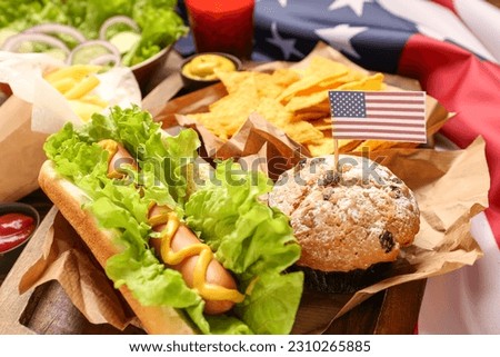 Board with tasty dishes for Memorial Day celebration, closeup