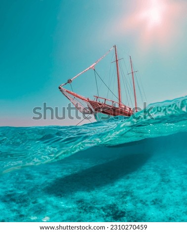 Split landscape photo with dome port, in the lower part the marvelous seabed of the La Maddalena archipelago, in the upper part a sailing ship that plows through the emerald sea.