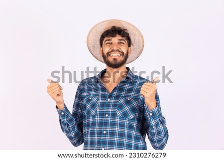 Young boy farmer boy with thumb up