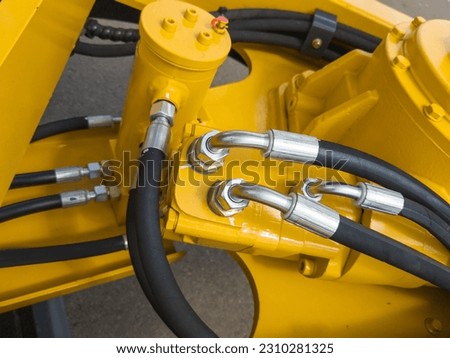 many hydraulics hoses on a machine Royalty-Free Stock Photo #2310281325