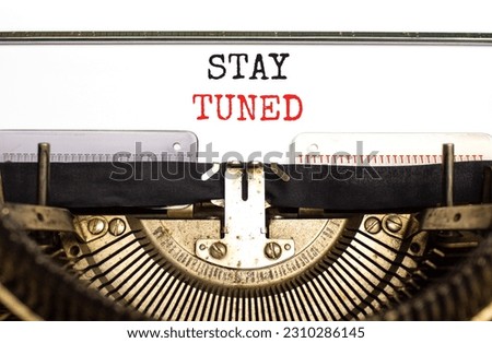 Stay tuned symbol. Concept words Stay tuned typed on beautiful old retro typewriter. Beautiful white background. Business, support, motivation, psychological and stay tuned concept. Copy space. Royalty-Free Stock Photo #2310286145