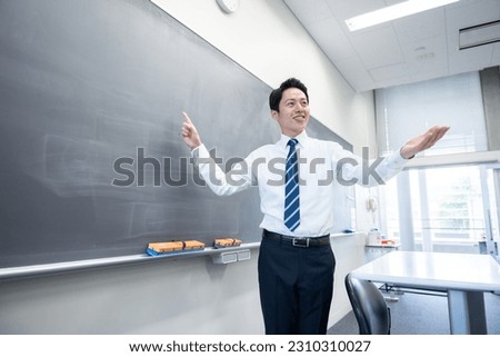 Teacher teaching in the classroom Royalty-Free Stock Photo #2310310027