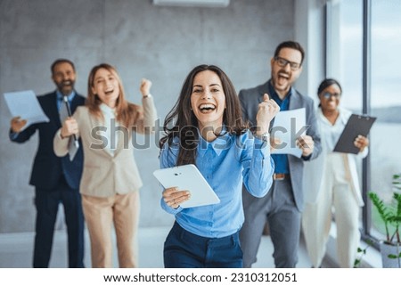 Team Huddle Harmony Togetherness Happiness Concept. Group of joyful excited business people throwing papers and having fun in office. Group of team creative business people Happy to be successful Royalty-Free Stock Photo #2310312051