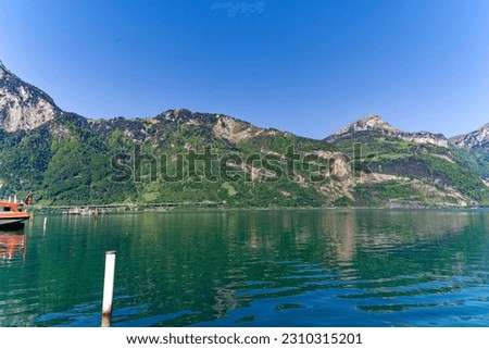 Scenic view of mountain panorama with Lake Lucerne on a sunny spring morning. Photo taken May 22nd, 2023, Flüelen, Canton Uri, Switzerland.