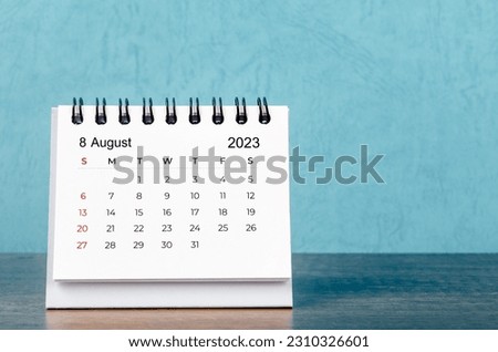 August 2023 desk calendar on blue color background, Vintage style. Royalty-Free Stock Photo #2310326601