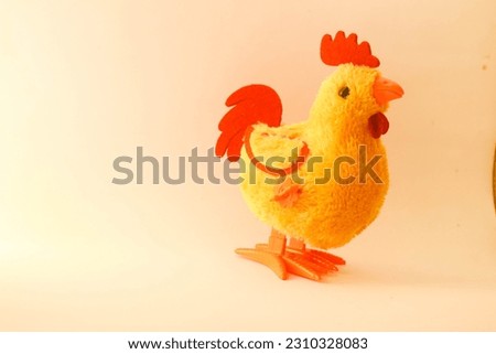 Toy chicken on a white background