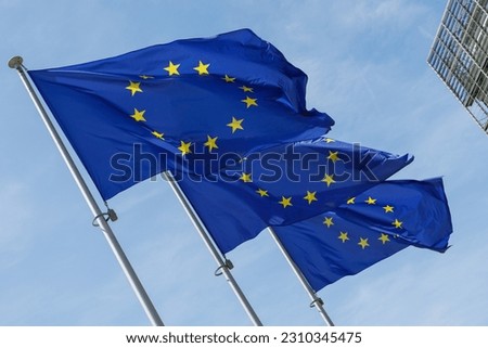 European flags in front of the Berlaymont building, headquarters of the European Commission Royalty-Free Stock Photo #2310345475