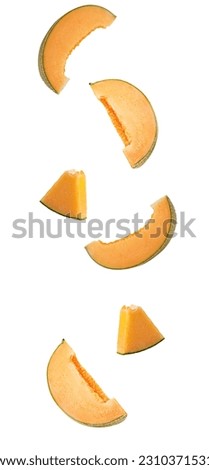 Pieces of melon in flight isolated on white background. Clipping Path. Full depth of field. Royalty-Free Stock Photo #2310371531
