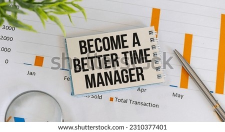 Holding a card with text BECOME A BETTER TIME MANAGER, business concept image with soft focus background and vintage tone
