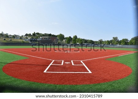 Artificial turf on a softball field Royalty-Free Stock Photo #2310415789